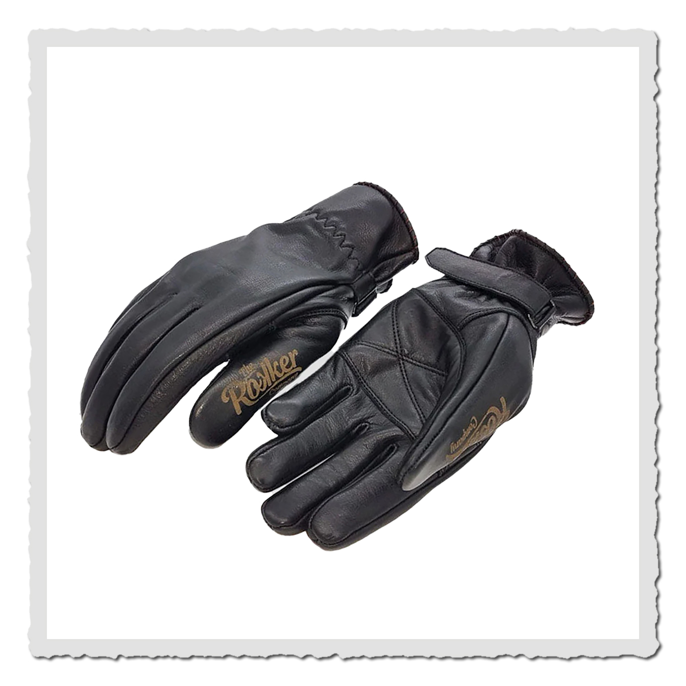 Zwei schwarze Leder-Motorradhandschuhe mit Klettverschluss, leicht versetzt fotografiert, weißer Hintergrund.